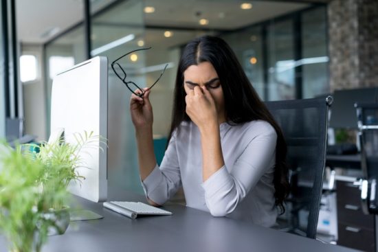 woman experiencing computer eye strain