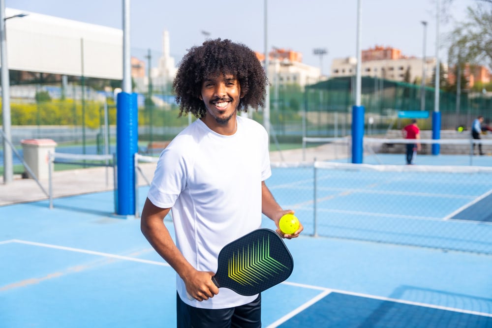Man playing pickleball without glassses after having LASIK.