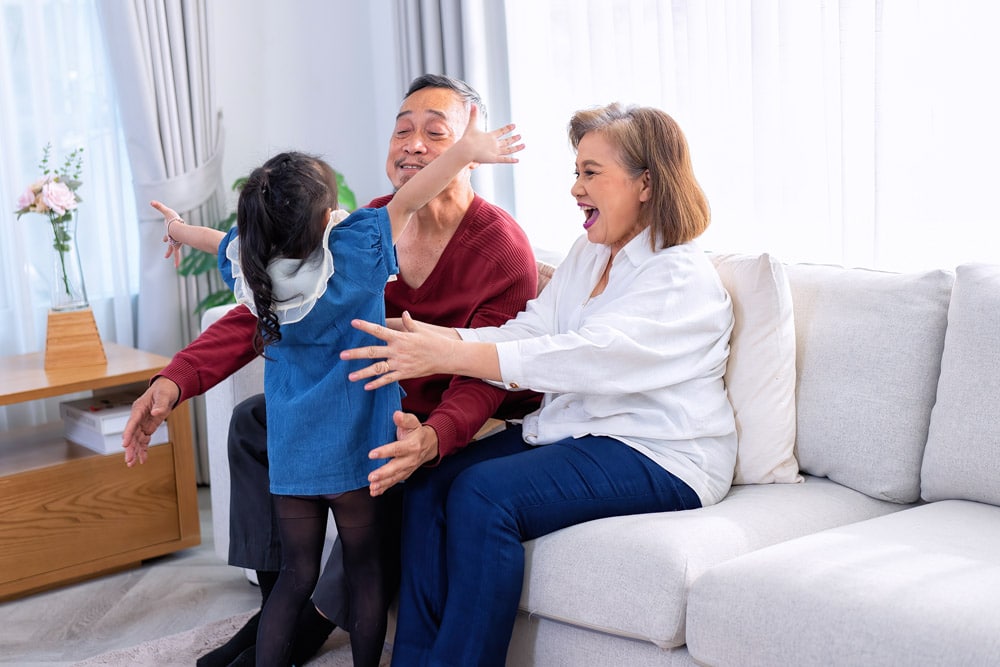 Grandparents happy to see their granddaughter.