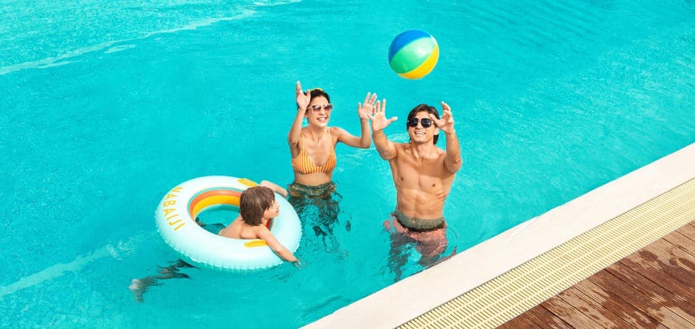 Family wearing their summer eye care glasses while soaking in the sun