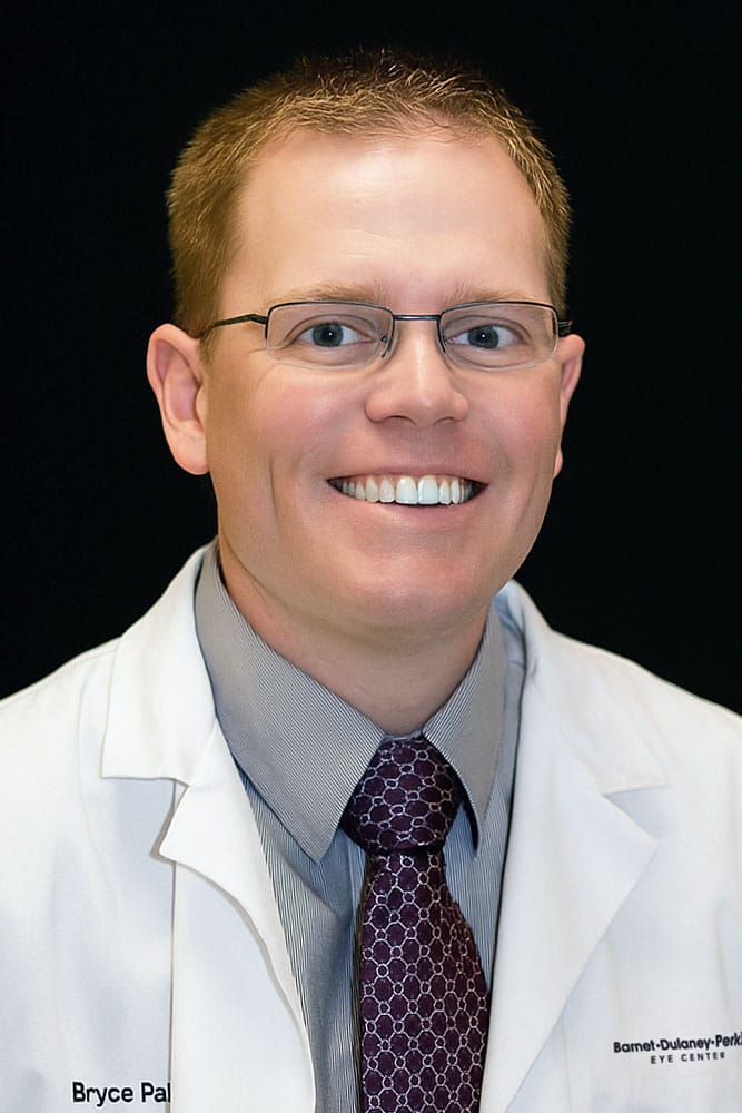 Professional headshot of Dr. Bryce Palmer, OD against a black backdrop.