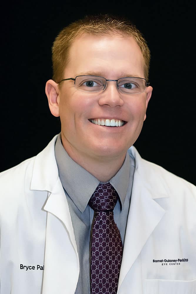 Professional headshot of Dr. Bryce Palmer, OD against a black backdrop.