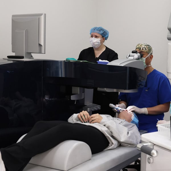 LASIK Surgeon performing the procedure on his patient.