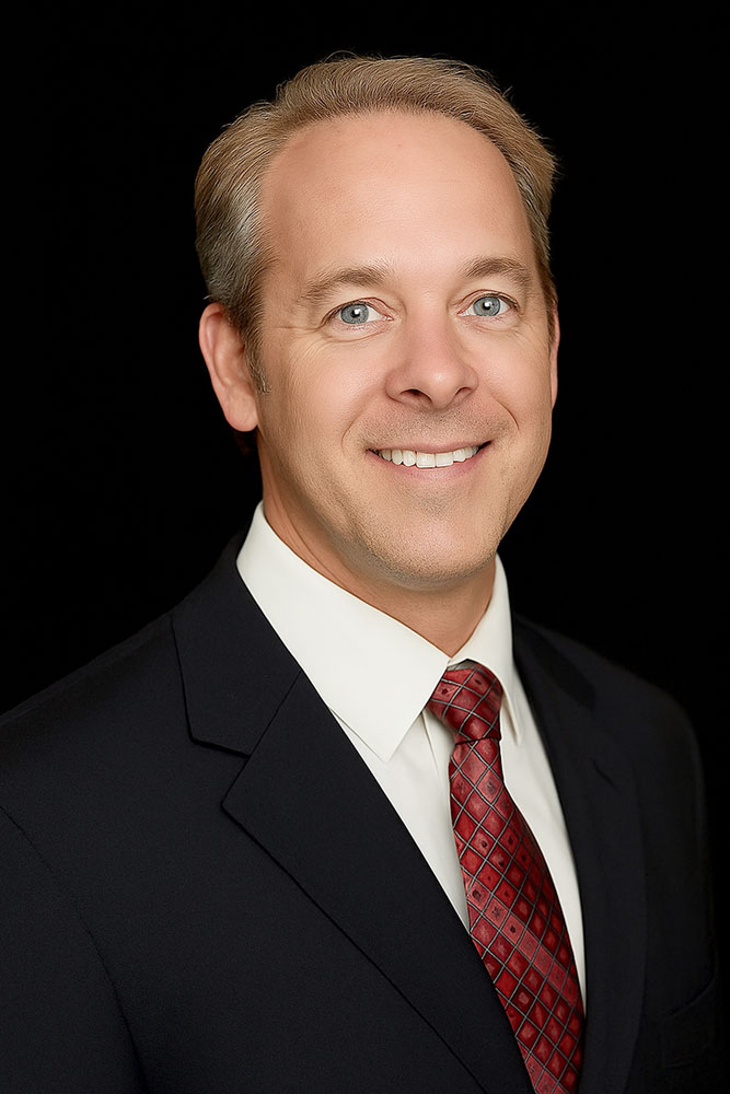 Professional headshot of Dr. Michael Martin, OD against a black backdrop.