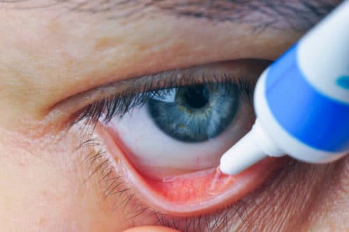 person applying eye gel to inside of eyelid