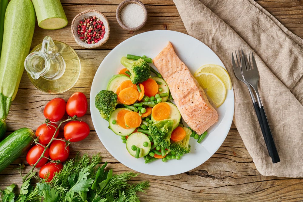 salmon with fresh ingredients an vegetables with eye health benefits.