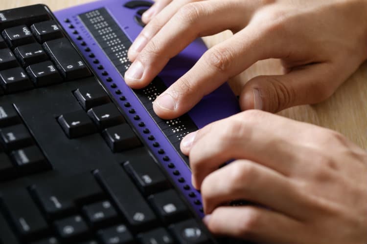 blind person using braille computer keyboard visual aid