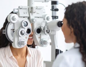 Optometrist performing an eye exam on a patient to check for eye floaters