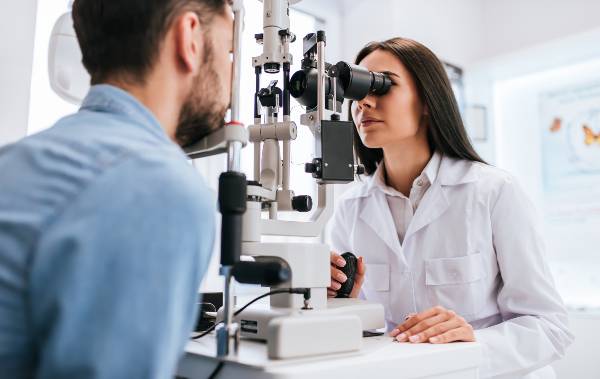 Doctor conducting an ophthalmoscopy test