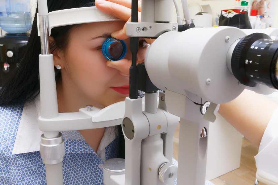 Woman getting eyes checked for prescription