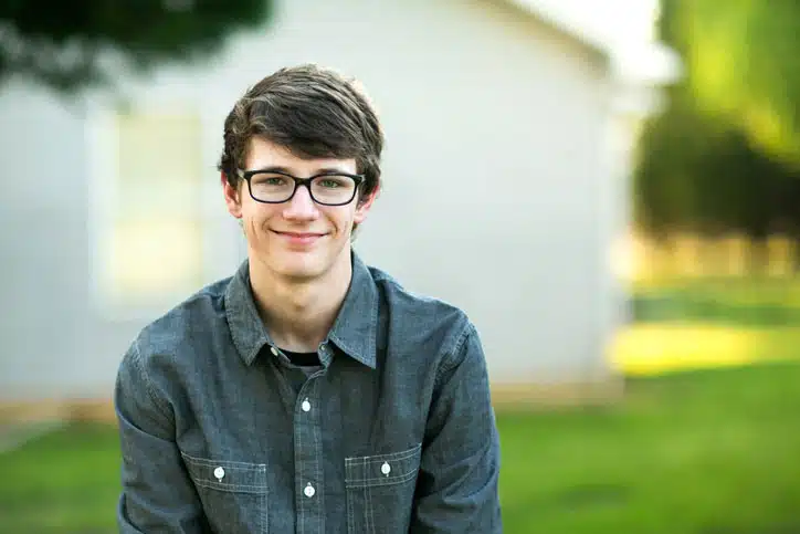 Teen enjoying new glasses after eye exam at BDP Optical Shop