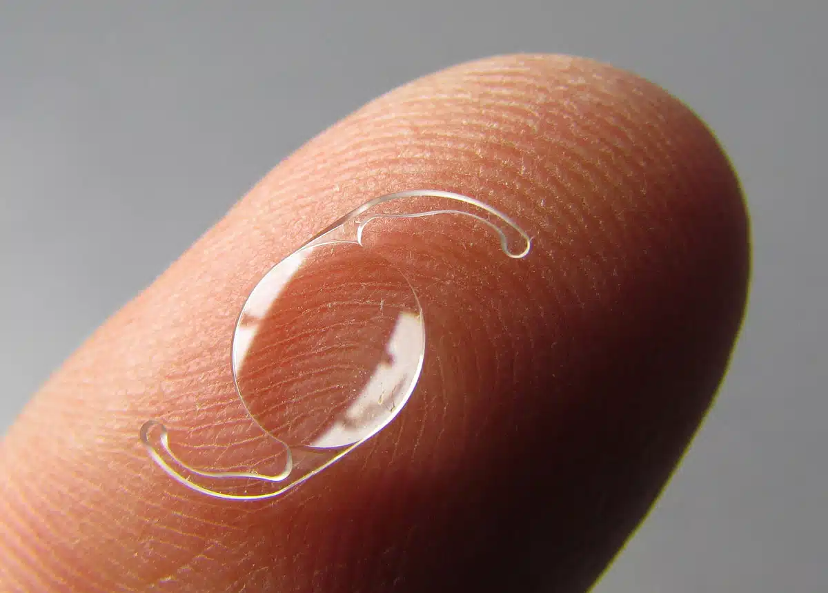 IOL lens implant on finger that is used at Barnet Dulaney Perkins