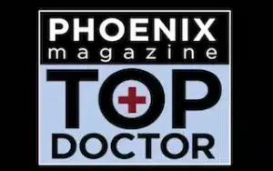 Phoenix magazine Top Doctor logo featuring a red cross inside the O of TOP.