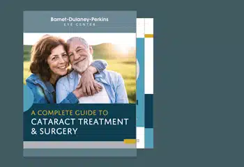 Cover of Barnet Dulaney Perkins Eye Center’s “A Complete Guide to Cataract Treatment & Surgery,” featuring a smiling older couple outdoors.