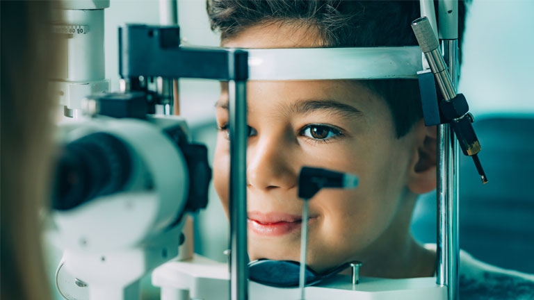 Photo of a young boy having an eye exam with Barnet Dulaney Perkins Eye Center.