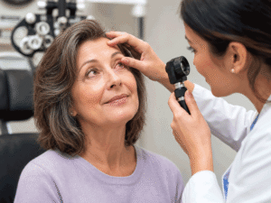 60-year-old woman with conjunctivitis looking up during an eye exam, illustrating eye infection symptoms at Barnet Dulaney Perkins Eye Center.