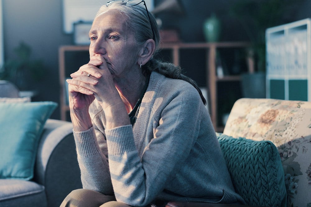 Older woman considering cataract surgery and wondering, does cataract surgery hurt?